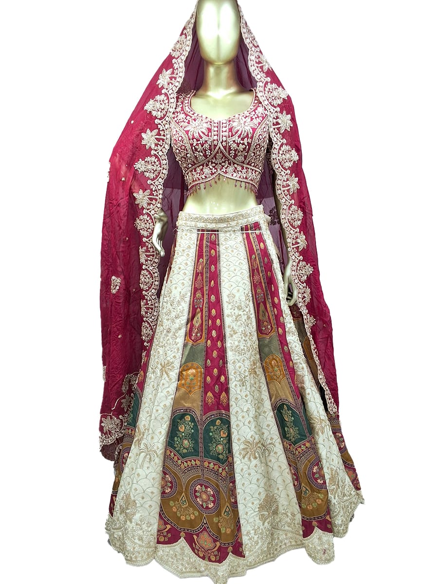 Ivory and magenta panelled bridal lehenga on a mannequin